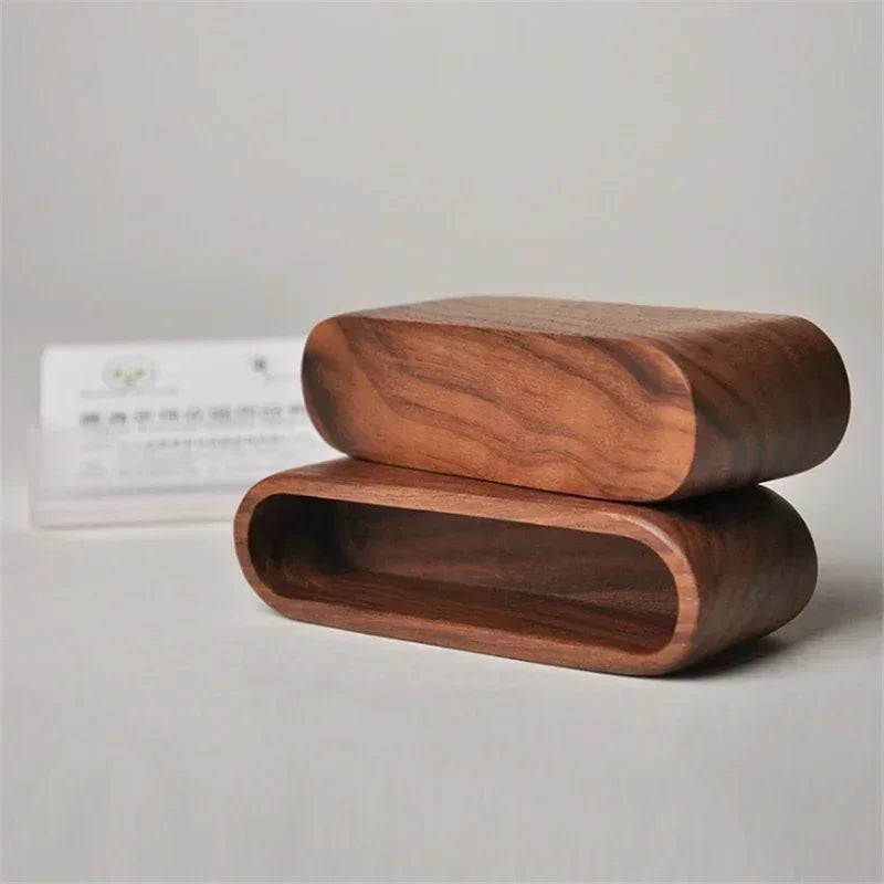 Minimalist dark wood desk organizer for business cards and notes, featuring a sleek, rounded rectangular design.