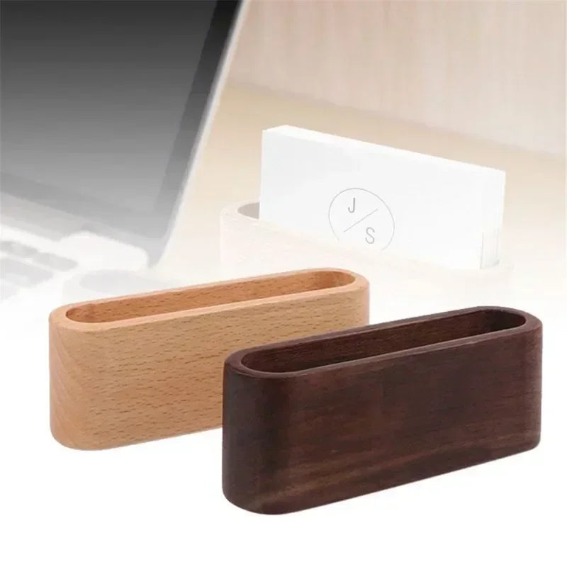 Minimalist natural wood business card holder in light and dark brown, oval design for desk organization.