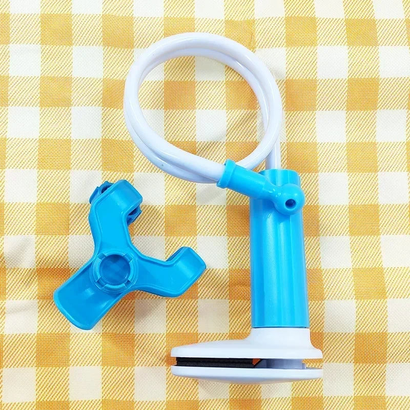 White and blue flexible baby monitor holder with a long adjustable arm and clamp, on a yellow checkered surface.
