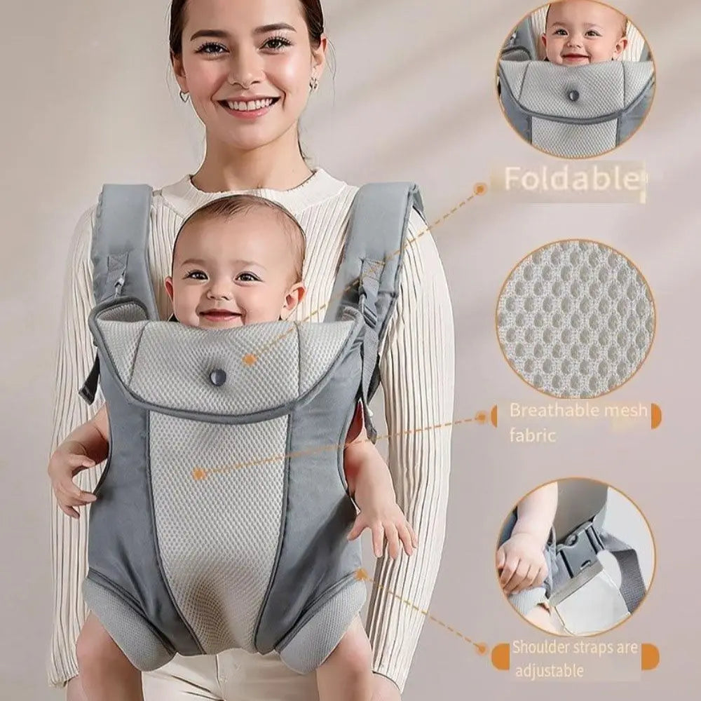 Smiling woman carrying a baby in a gray ergonomic, breathable mesh baby carrier with adjustable straps.