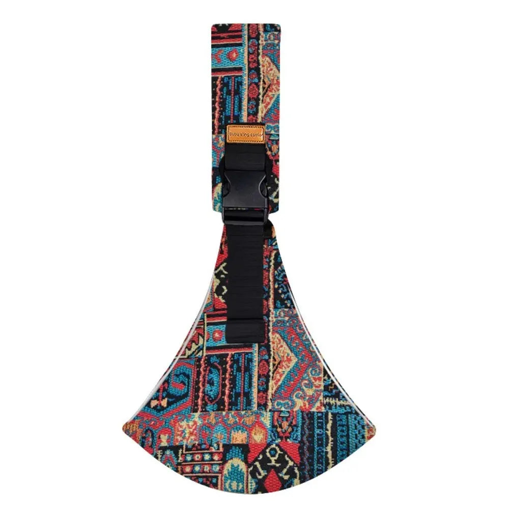 Adjustable cotton baby carrier with a colorful, patterned tribal design and black buckle.