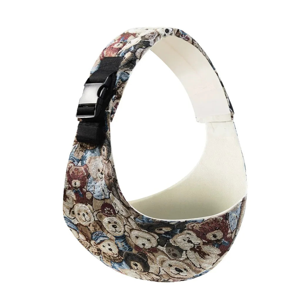 Adjustable cotton baby carrier with a colorful teddy bear pattern and black buckle.