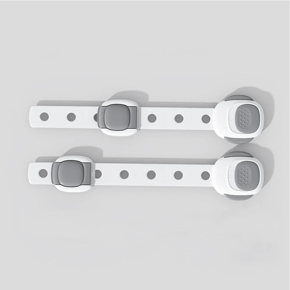 Two white plastic toilet safety locks with gray buttons, designed for child and pet protection.