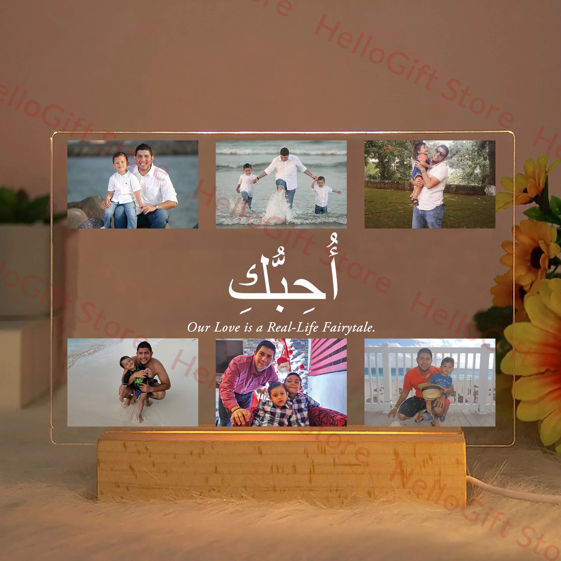 Personalized acrylic LED night light with custom photos, "I Love You" in Arabic, and "Our Love is a Real-Life Fairytale" text on a wooden base.