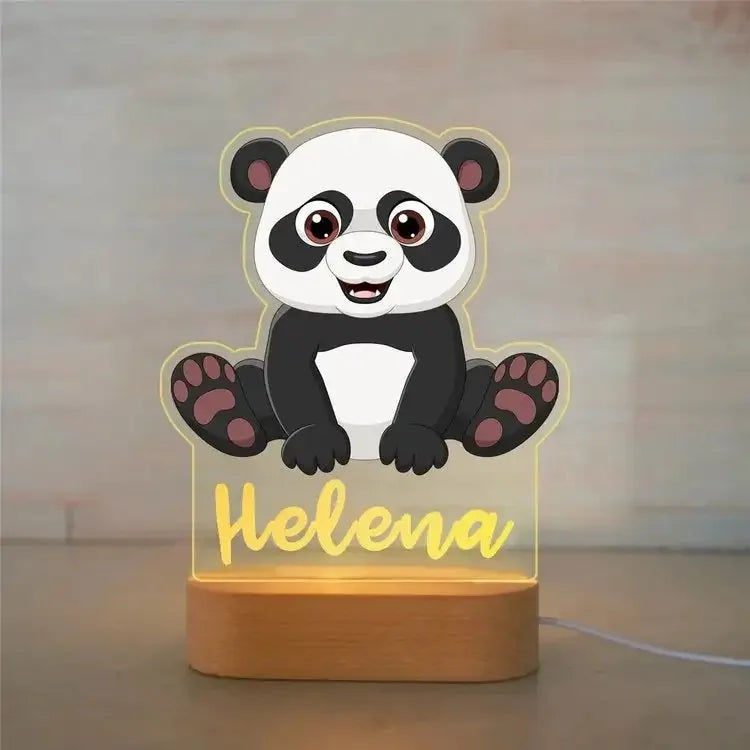 Personalized panda night light with "Helena" in yellow, clear acrylic, and a warm wooden base.