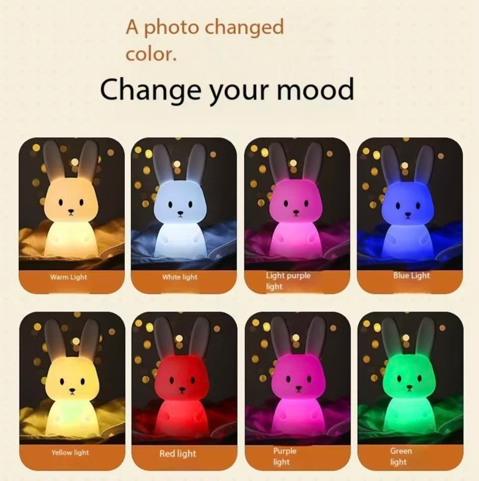 Silicone rabbit night light displaying eight different LED color options: warm, white, purple, blue, yellow, red, magenta, and green.