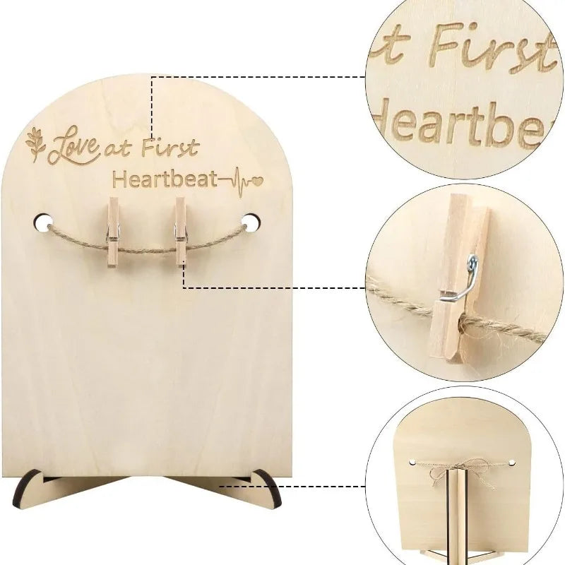 Wooden ultrasound photo frame with "Love at First Heartbeat" engraving, twine, and mini clothespins.