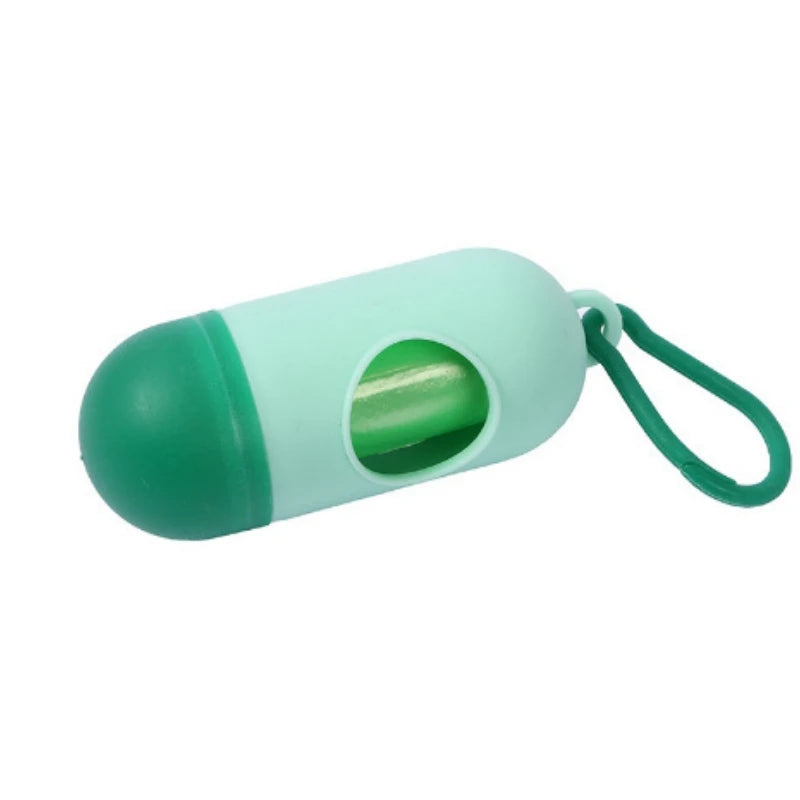 Mint green capsule-shaped portable waste bag dispenser with dark green cap and loop for diapers.