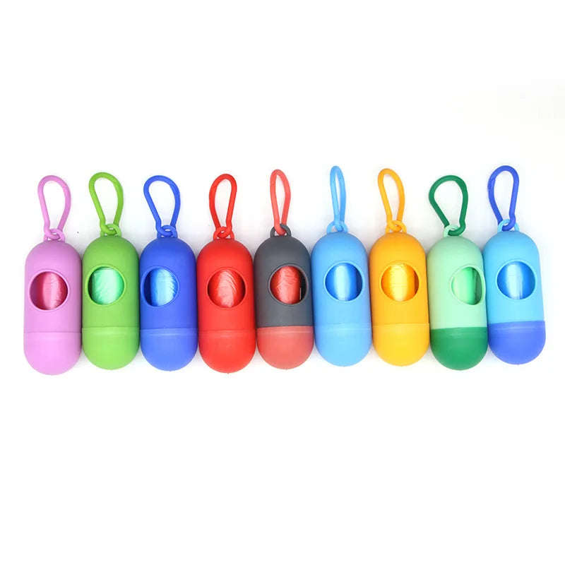 Colorful capsule-shaped portable waste bag dispensers with hooks, ideal for diapers or pet waste.