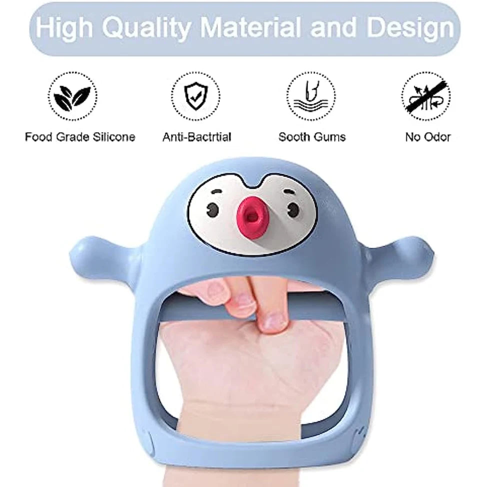Light blue penguin-shaped silicone baby teether and pacifier, worn on a hand, with feature icons.