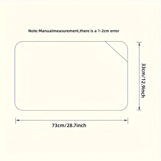 Diagram of a rectangular baby stroller cushion, 73cm x 33cm, with rounded corners and a diagonal cut.