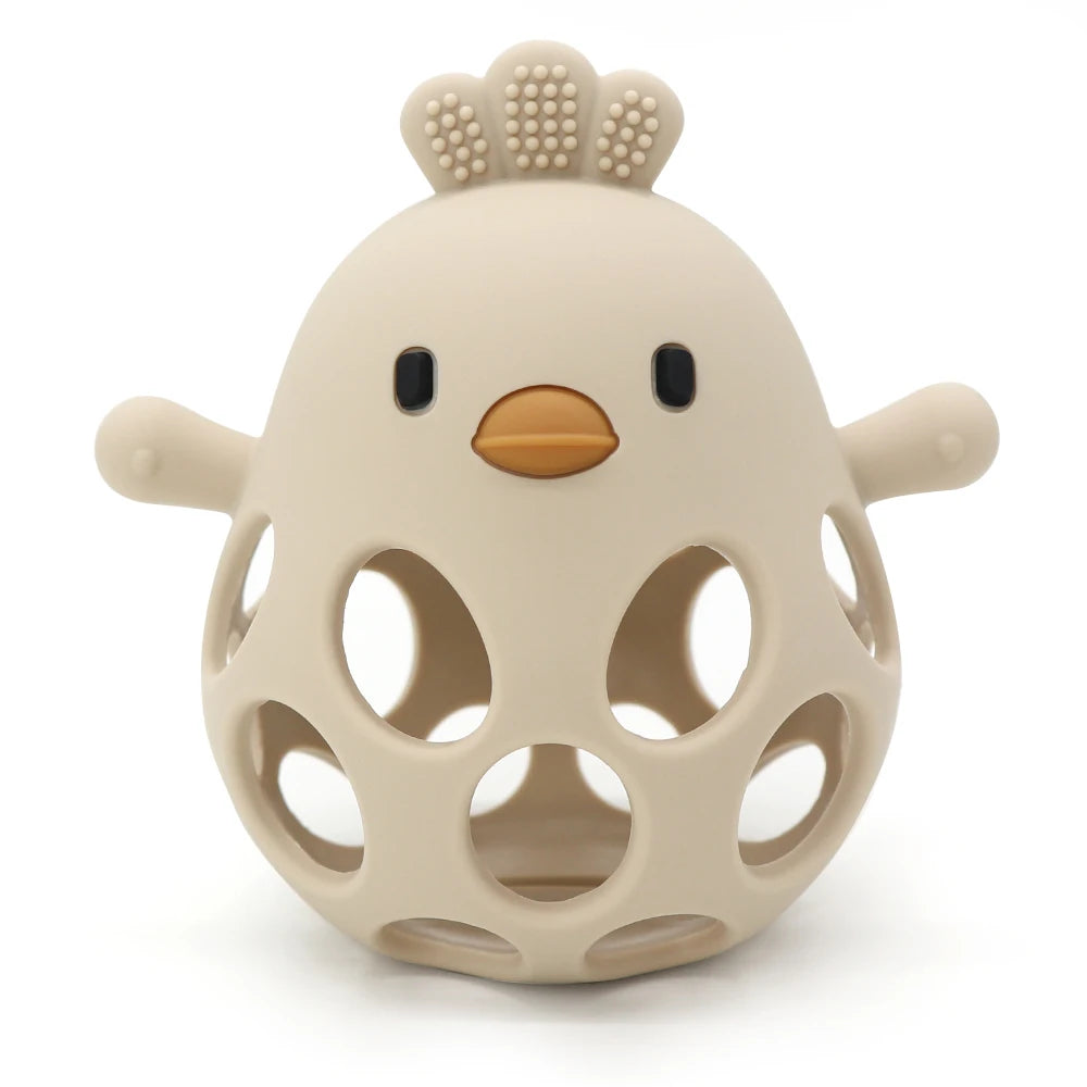 Beige hollow silicone chick baby teether with textured comb and easy-grip design.