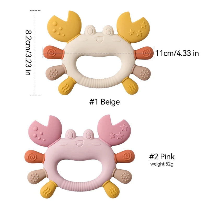 Two silicone crab teethers, one beige and yellow, the other pink, with textured claws and legs.