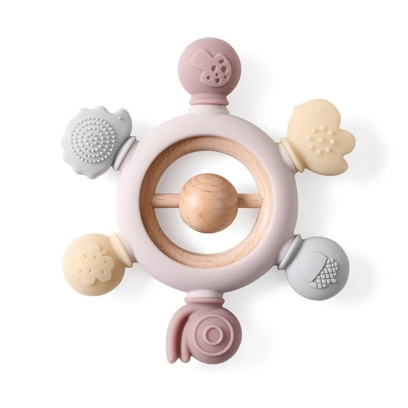 Montessori forest design baby teether with soft silicone and natural wood ring, featuring varied textures.