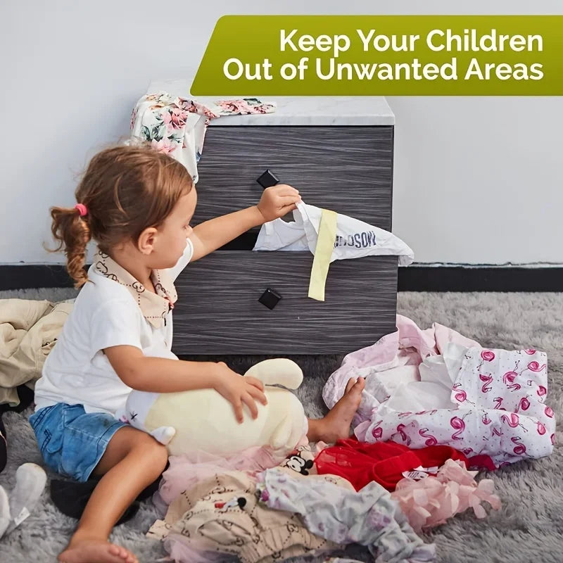 Toddler reaching into a dark gray dresser drawer, surrounded by clothes, illustrating the need for child safety locks.
