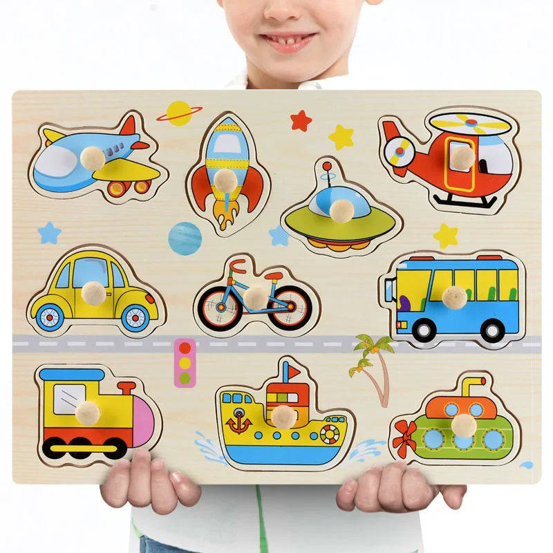Child holding a colorful wooden Montessori puzzle with various vehicle shapes and knobs.
