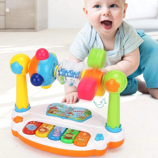 Happy baby playing with a colorful 4-in-1 musical piano toy featuring a spinning windmill.