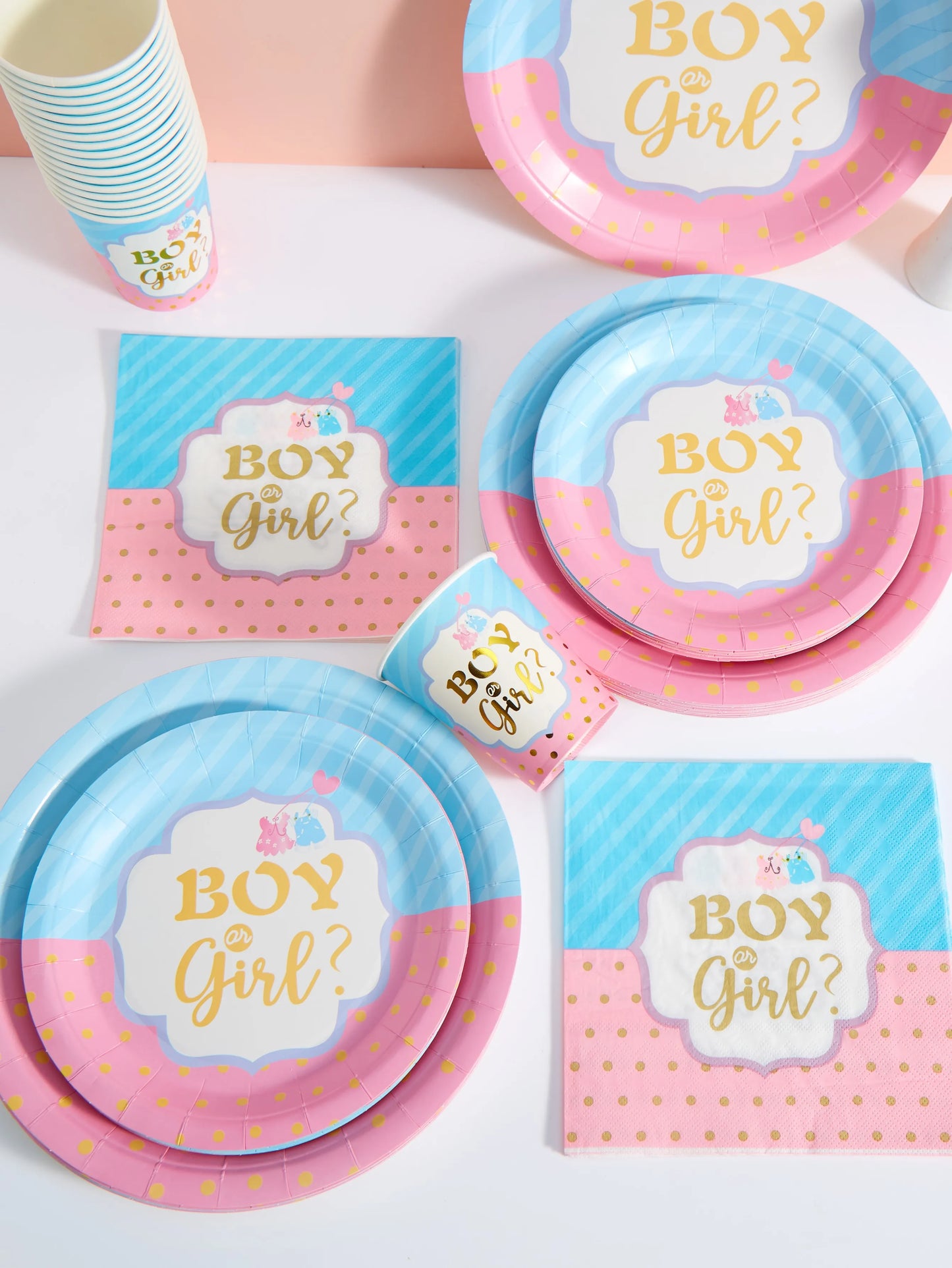 Pink and blue disposable party set with "Boy or Girl?" design, including plates, cups, and napkins.