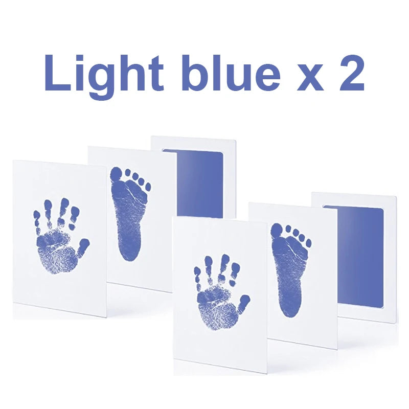 Two light blue, no-ink baby handprint and footprint kits, each with a print card and ink pad.