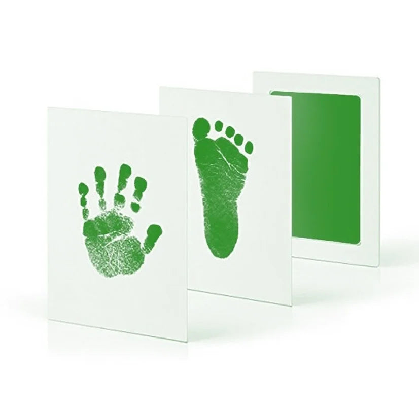 Green inkless baby handprint and footprint kit on white cards.