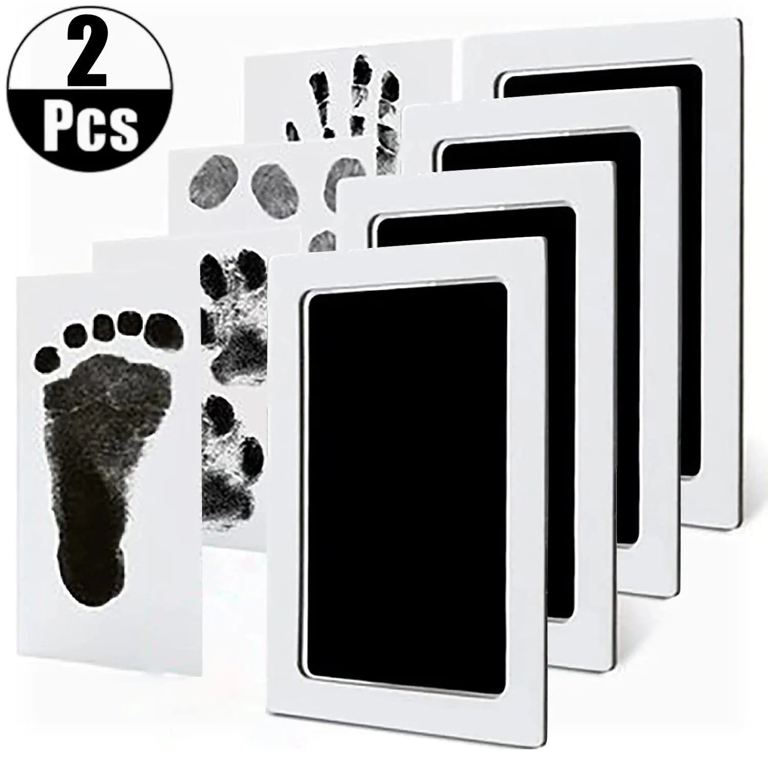 White no-touch baby handprint and footprint ink pad kit with black ink, showing two completed prints.