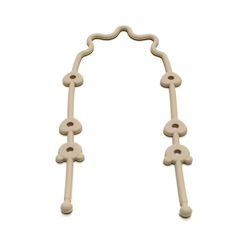 Adjustable beige silicone pacifier and bottle strap with heart-shaped connectors for strollers and car seats.