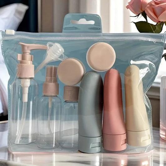 11-piece reusable travel bottle set in a clear pouch, featuring various pastel pink, blue, and beige containers.