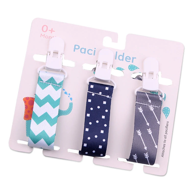 Set of 3 baby pacifier clips with white plastic clasps and patterned polyester straps.