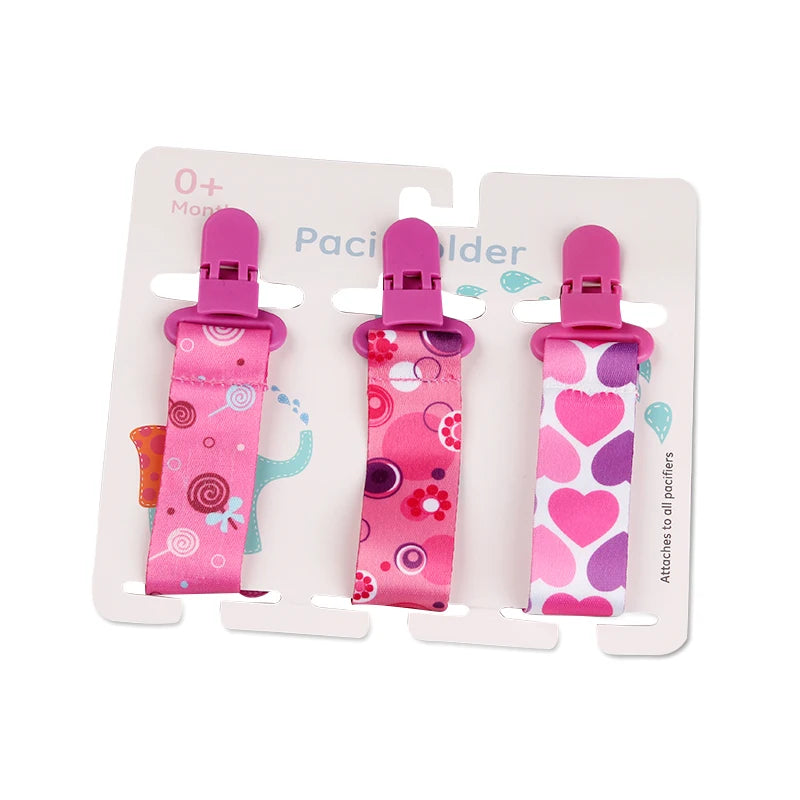 Set of 3 pink polyester pacifier clips with plastic clasps, featuring various patterns.