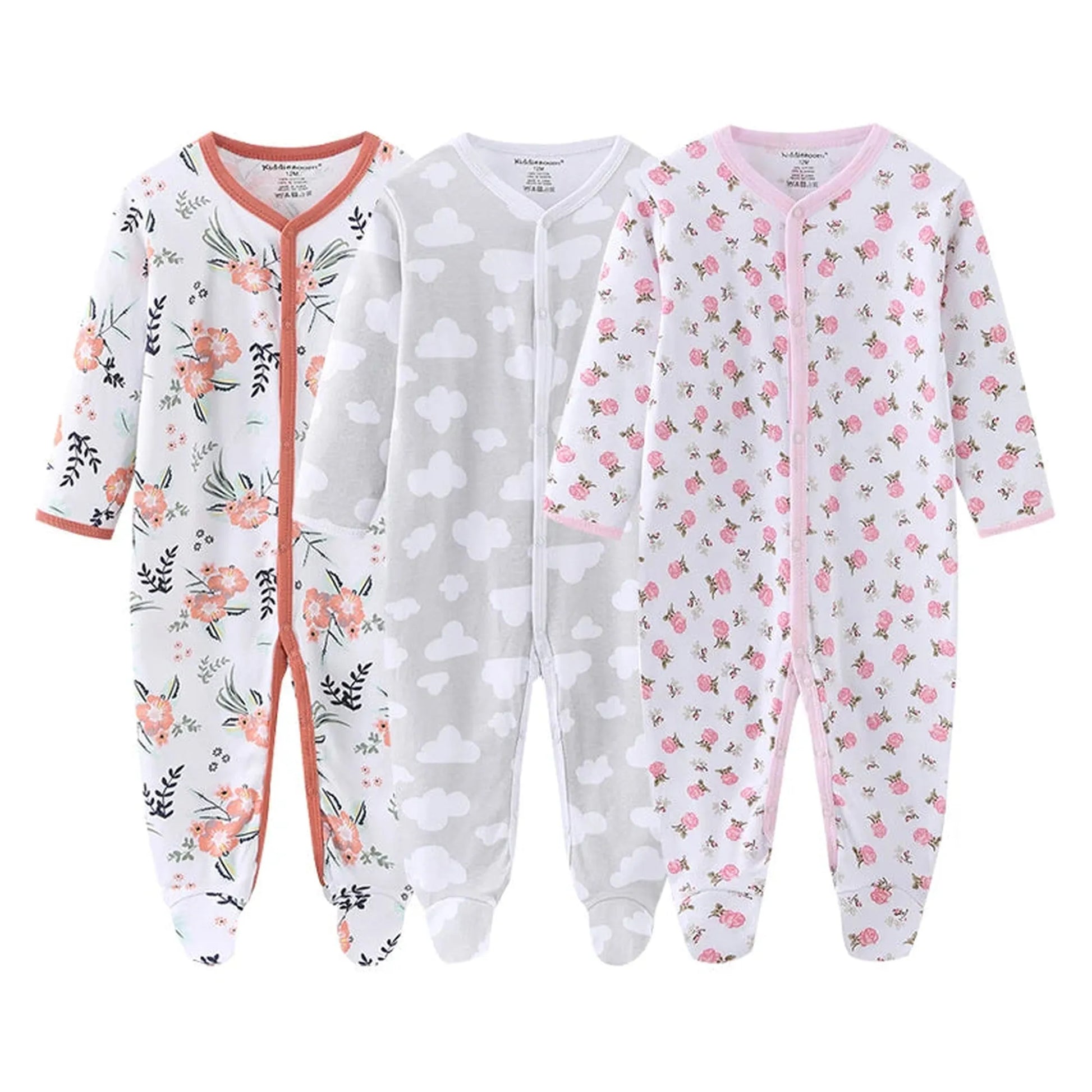 Three long-sleeve cotton baby rompers: white with peach floral, gray with white clouds, and white with pink floral.