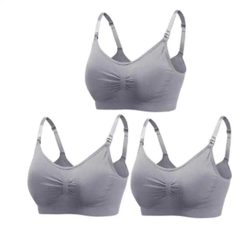 Set of three seamless, breathable grey nursing and maternity bras with clip closures.