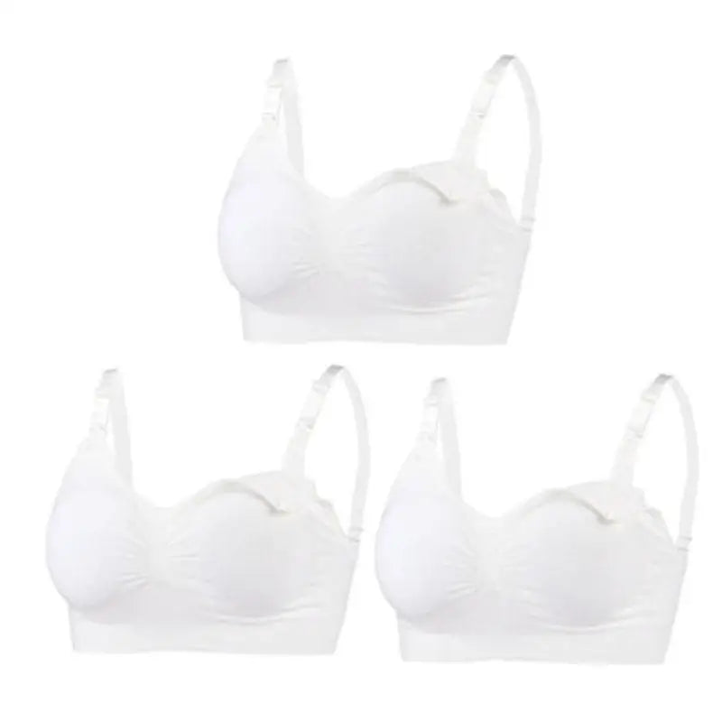 Set of 3 white seamless, wire-free, breathable maternity and nursing bras with adjustable straps.