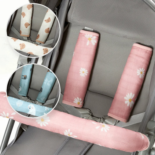 Pink daisy stroller handle cover and seat belt pads, with inset options for bear and animal designs.