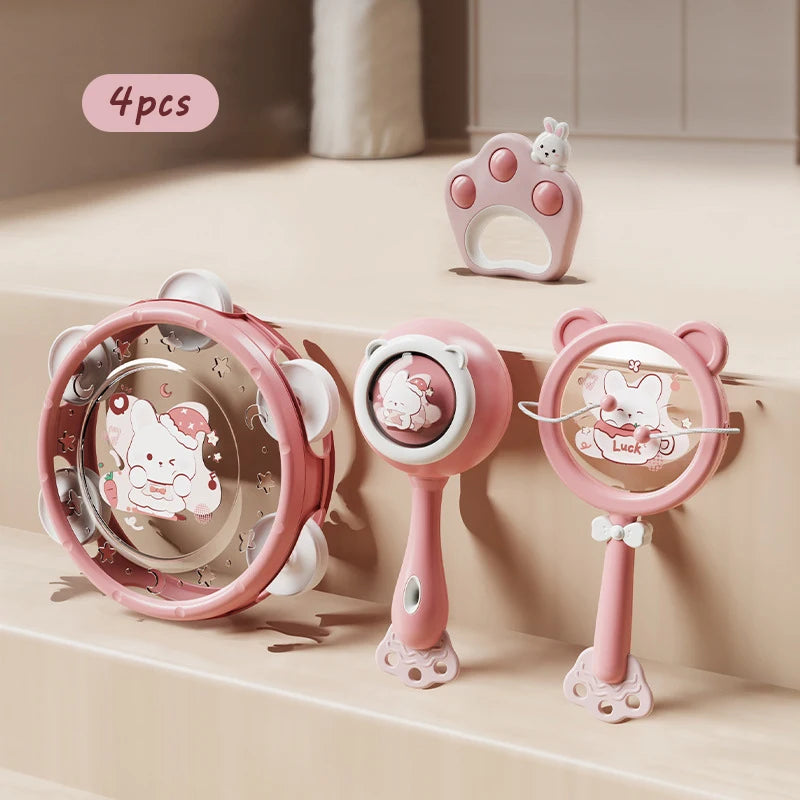 Pink Montessori musical rattles and tambourine set for babies, featuring animal designs.