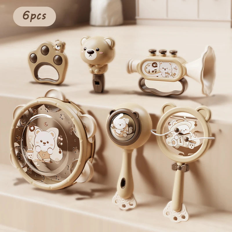 6-piece Montessori musical baby toy set in beige, featuring rattles, a drum, and a trumpet with bear designs.