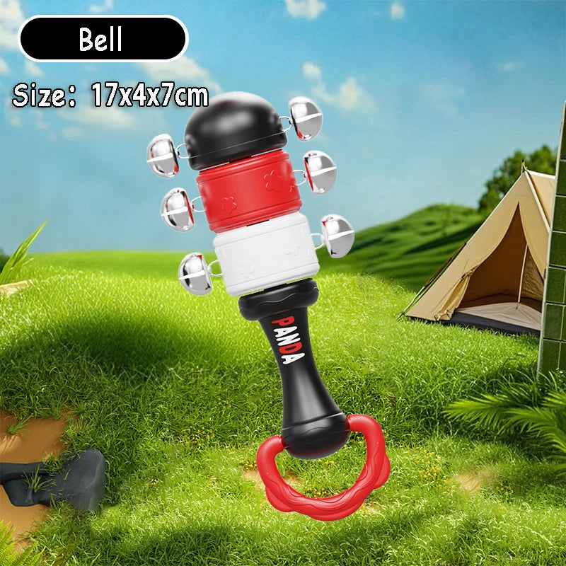 Montessori musical rattle with black, red, and white segments, silver bells, and a red teether handle.