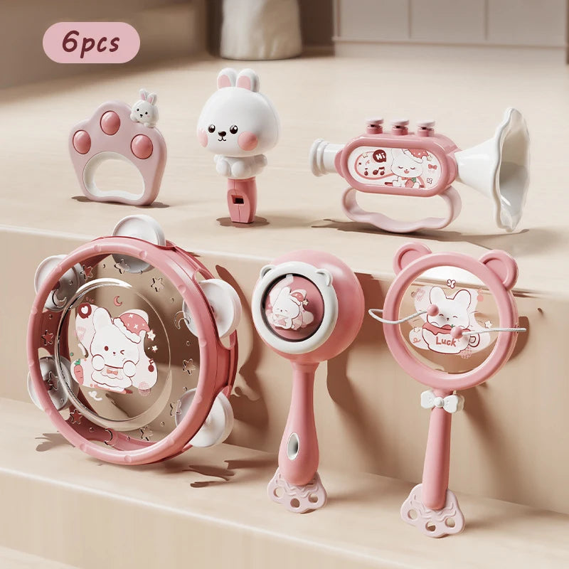 6-piece pink Montessori musical baby toy set with rattles, tambourine, trumpet, and animal designs.