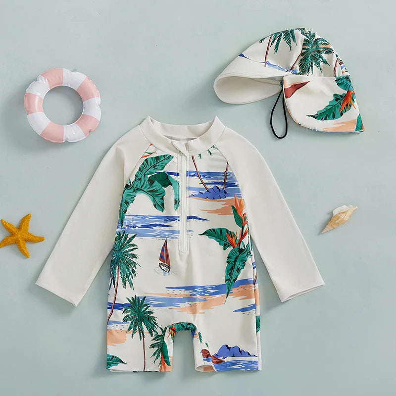 White long-sleeve rash guard swimsuit for kids with tropical print and matching sun hat.