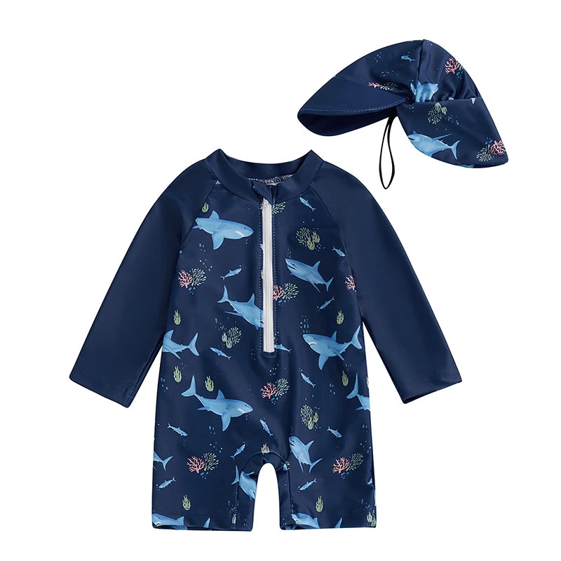 Kids' navy long-sleeve rash guard swimsuit with shark print and matching sun hat.