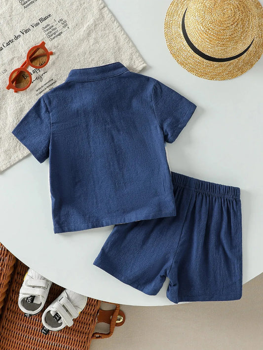 Navy blue cotton short-sleeve top and shorts set for baby boys, with patch design.