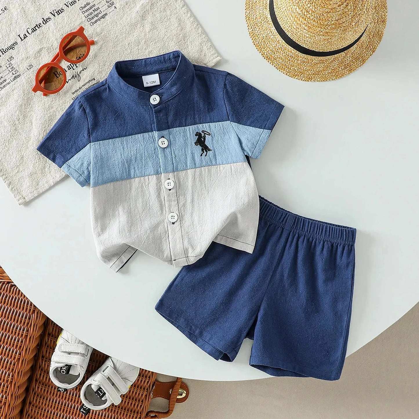 Baby boy's blue and white striped cotton short-sleeve shirt and matching shorts with horse embroidery.