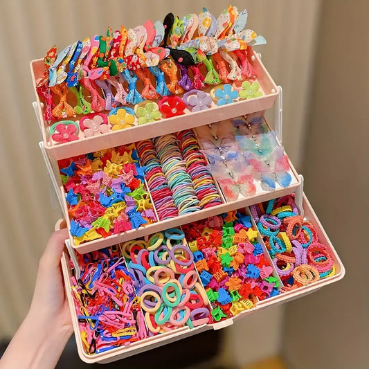 Tiered organizer filled with 555 colorful butterfly hair clips, flower clips, and elastic hair ties for girls.