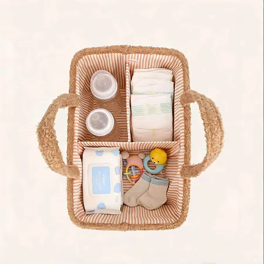 Soft brown fleece diaper caddy with striped interior, holding bottles, diapers, wipes, and baby items.