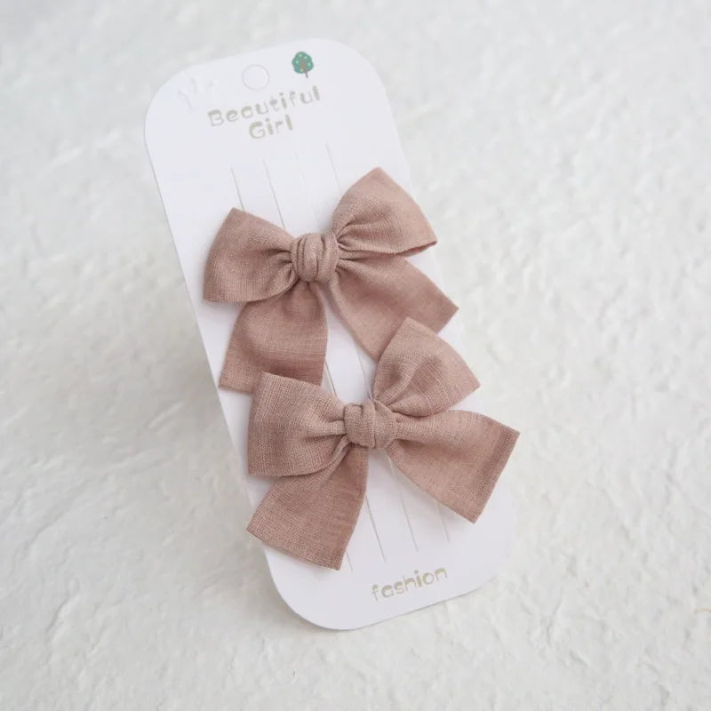 Two elegant pink cotton hair bows, 7.5cm, on a white "Beautiful Girl" card.