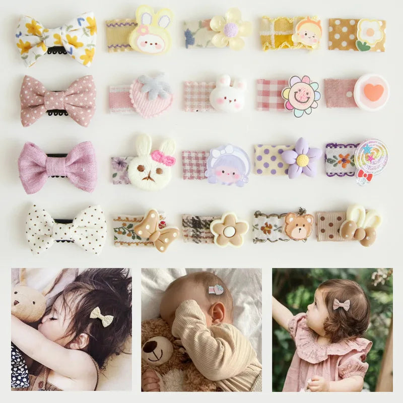 Assorted baby hair clips with decorative bows, animals, and flowers in pastel colors.