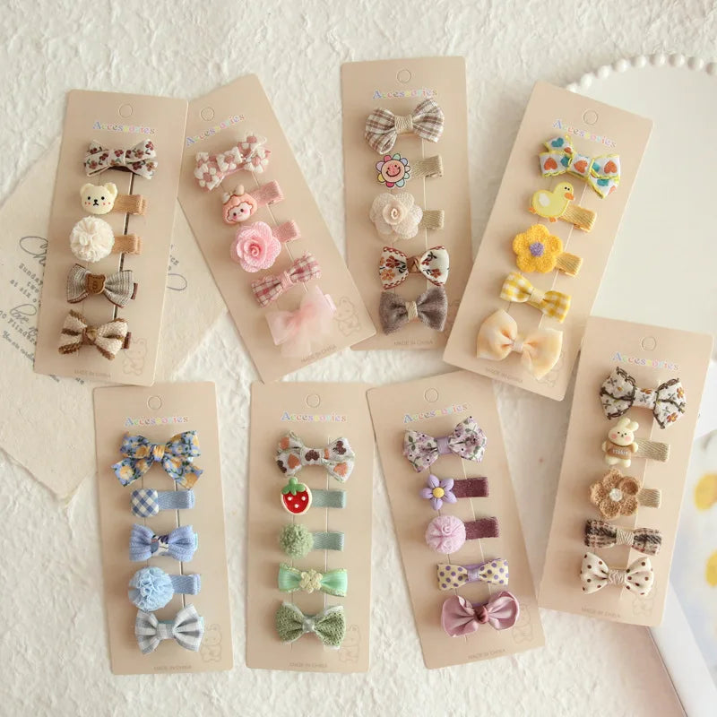 Five sets of assorted floral and animal-themed hair clips for babies and girls, 3.5cm long.