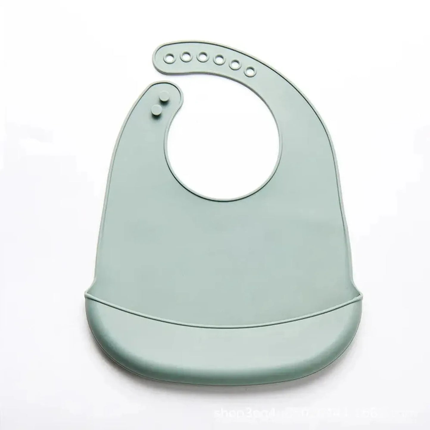 Soft green silicone baby bib with adjustable neck closure and food-catching pocket.