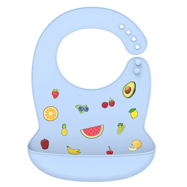 Light blue silicone baby bib with colorful fruit illustrations and a deep catch-all pocket.