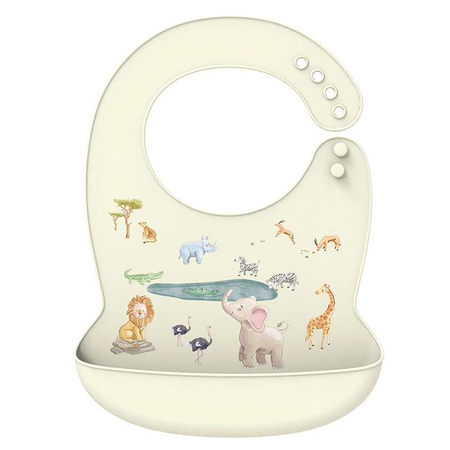 Cream silicone baby bib with adjustable neck and deep pocket, featuring colorful safari animal illustrations.