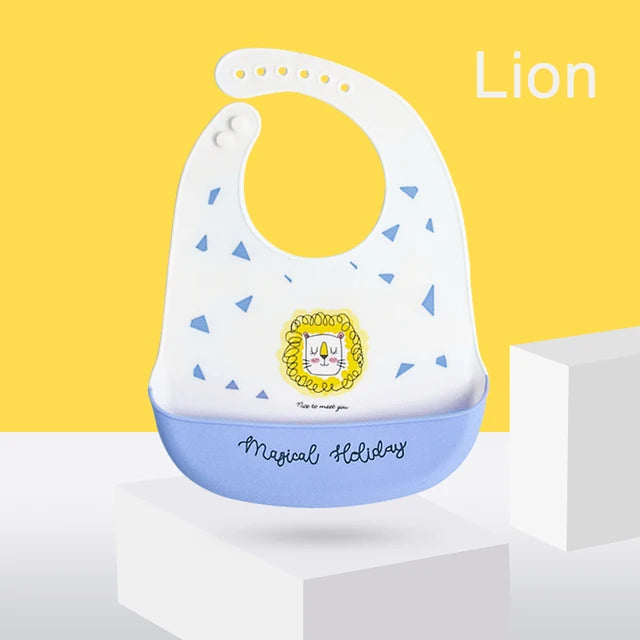 White and blue silicone baby bib with a lion design and adjustable neck strap.